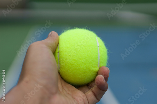 hand hole tennis ball © bignai