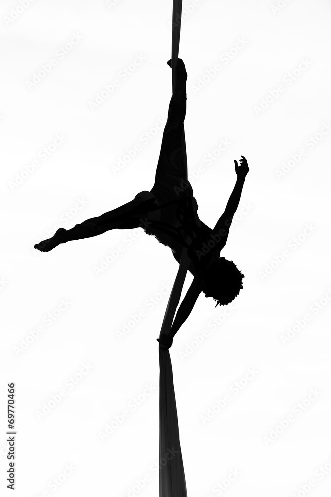 acrobatic woman dancer yoga on aerial silk, aerial contortion