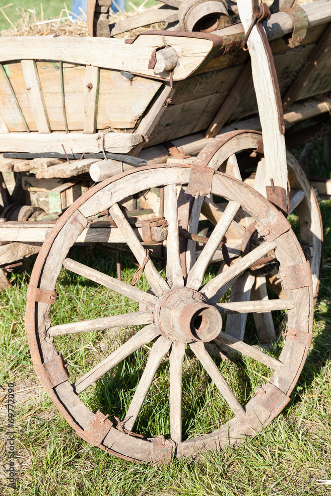 Closeup of old wooden cart with wheel