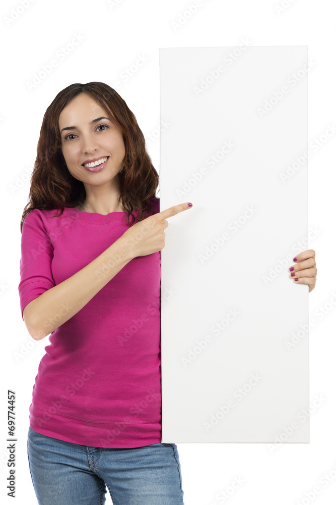 Smiling woman pointing to a billboard Smiling woman pointing to a billboard