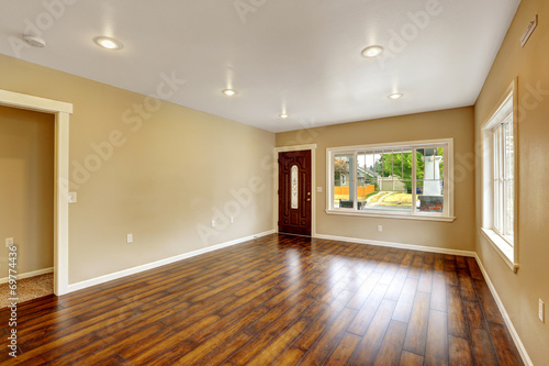 Empty house interior. Spacious living room with new hardwood flo