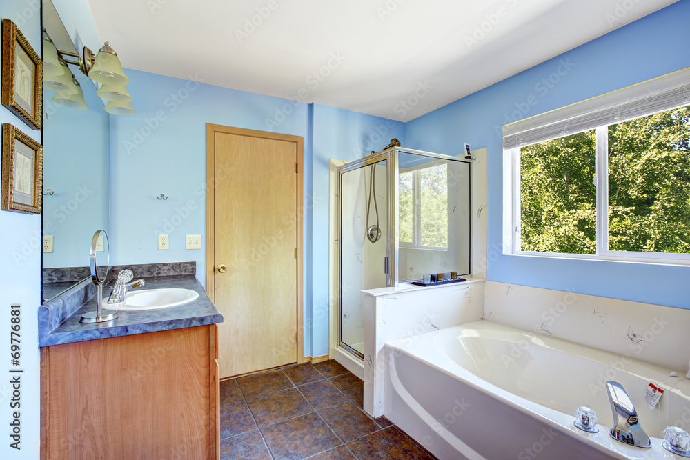 Very bright bathroom in light blue color Very bright bathroom in light blue color
