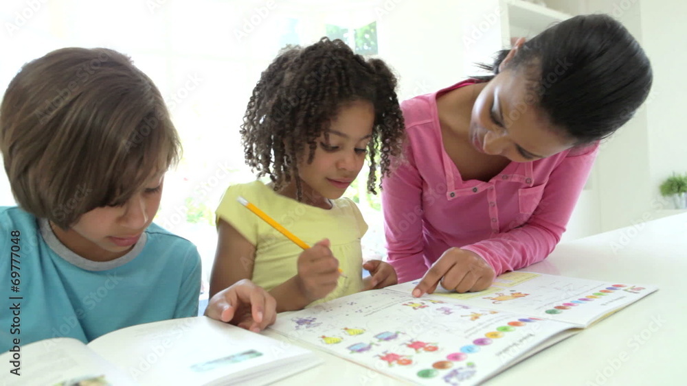 Mother Helping Children With Homework Mother Helping Children With Homework