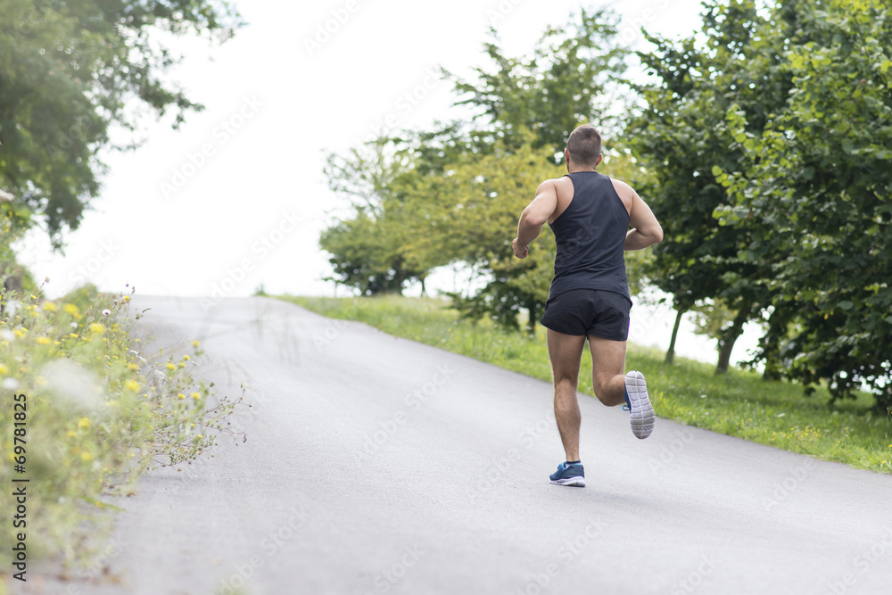Athletic man running uphill, outdoor. Athletic man running uphill, outdoor.