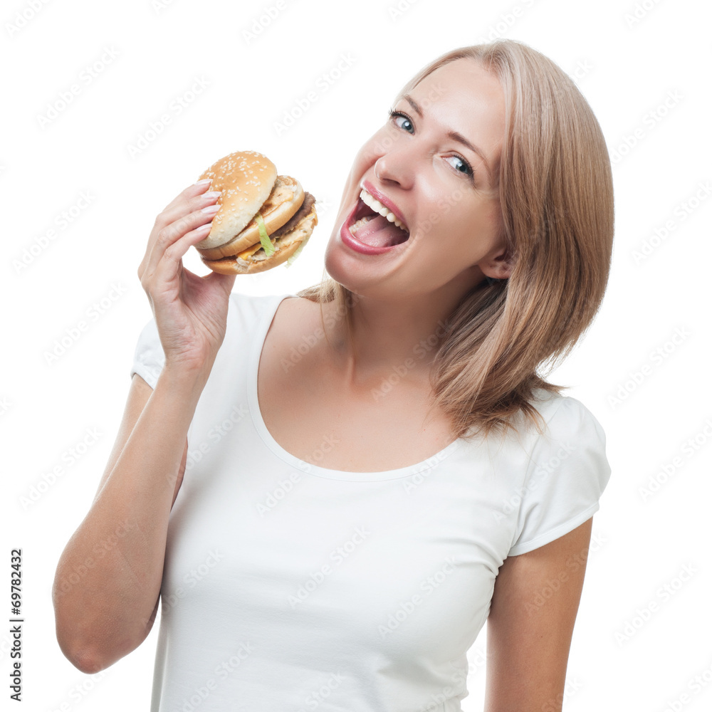 Girl eating burger isolated on white background Girl eating burger isolated on white background