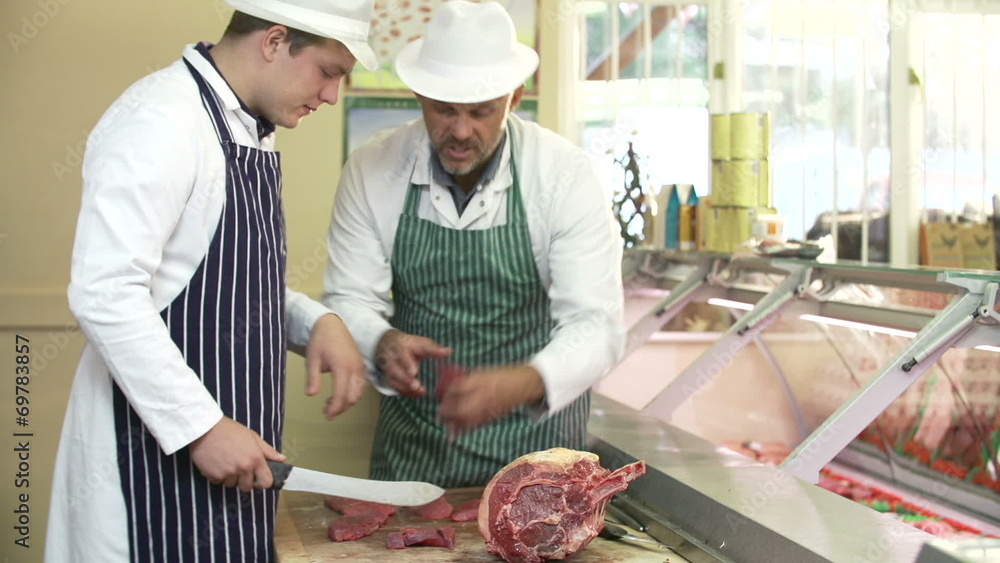 Butcher Teaching Apprentice How To Prepare Meat Butcher Teaching Apprentice How To Prepare Meat