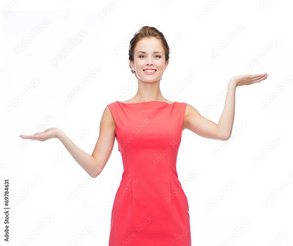 smiling woman holding something imaginary on palms smiling woman holding something imaginary on palms