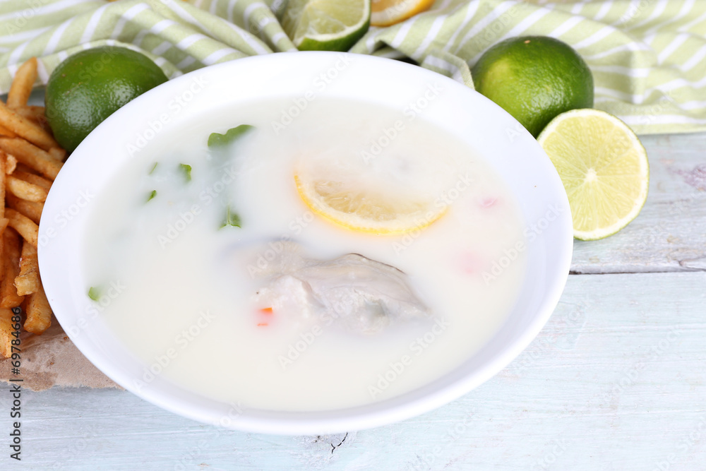 Tasty soup with oysters on wooden table Tasty soup with oysters on wooden table