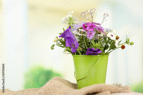 Fototapeta Naklejka Na Ścianę i Meble -  Bouquet of colorful flowers in decorative vase,