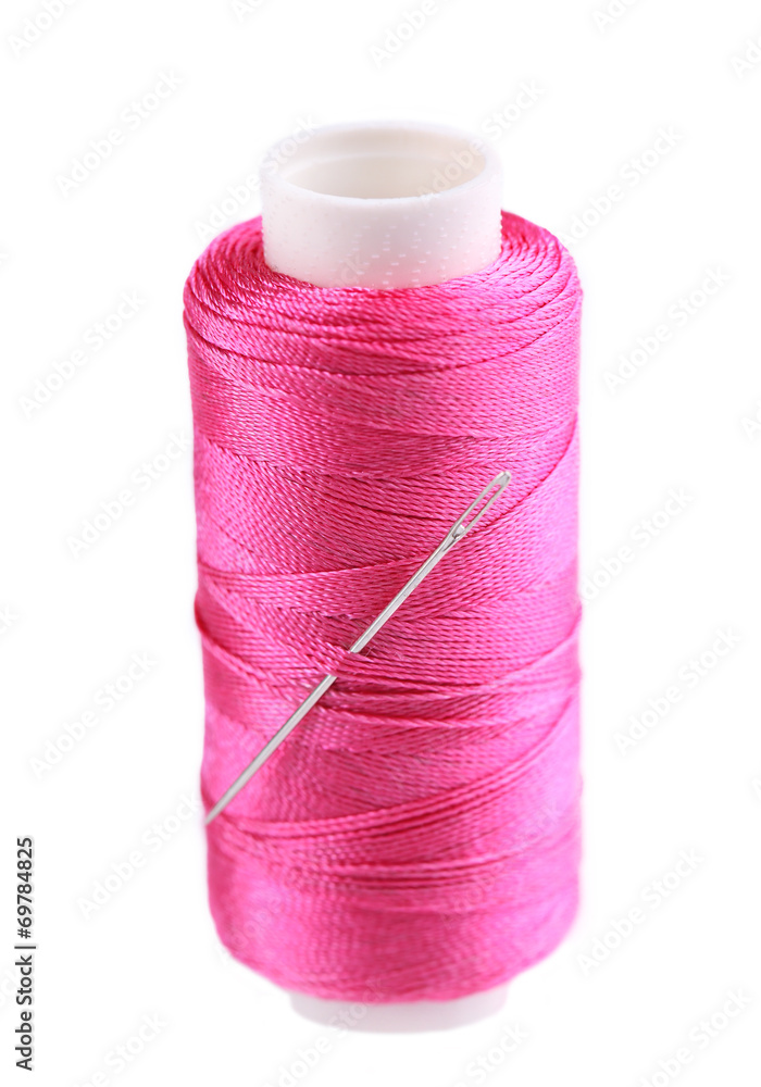 Needle and spool of thread isolated on white Needle and spool of thread isolated on white