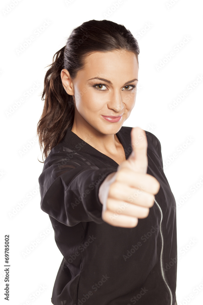 happy young woman with thumb up on white background happy young woman with thumb up on white background