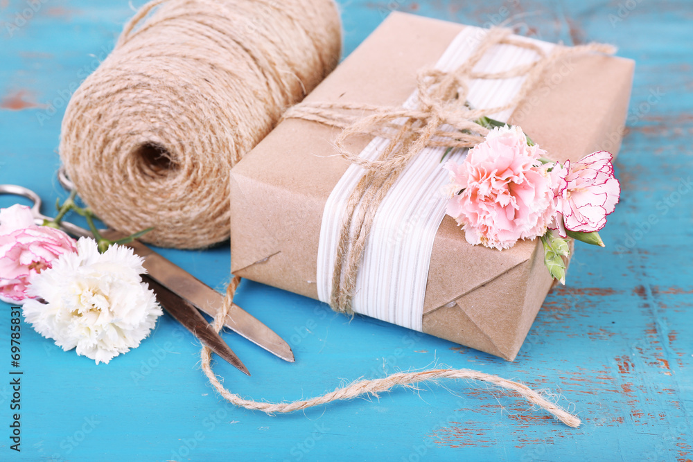 Beautiful gift with flowers and decorative rope, Beautiful gift with flowers and decorative rope,