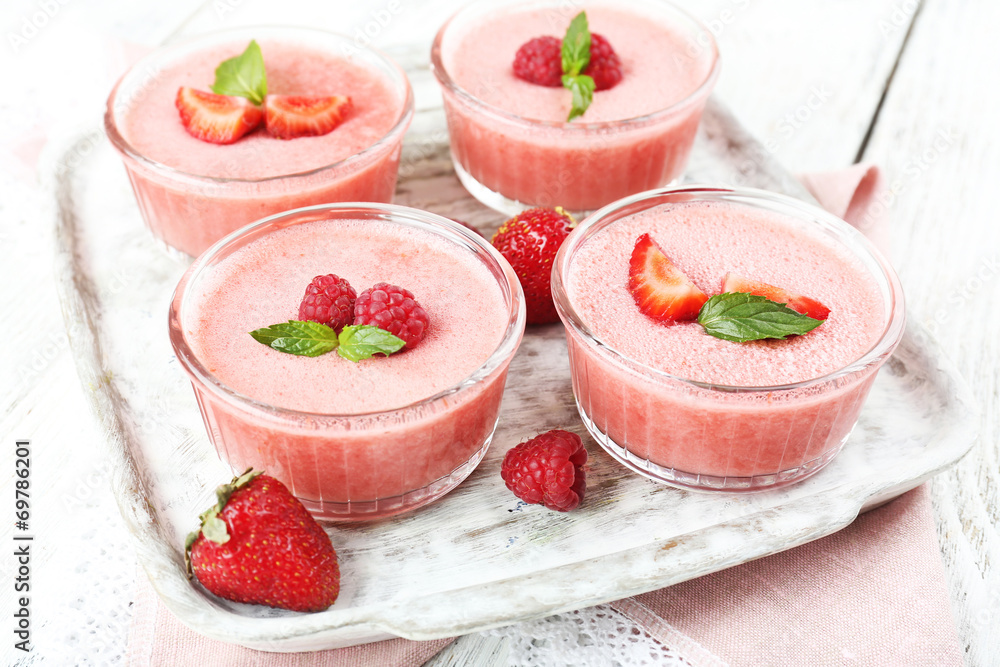 Delicious berry mousse in bowls on table close-up Delicious berry mousse in bowls on table close-up
