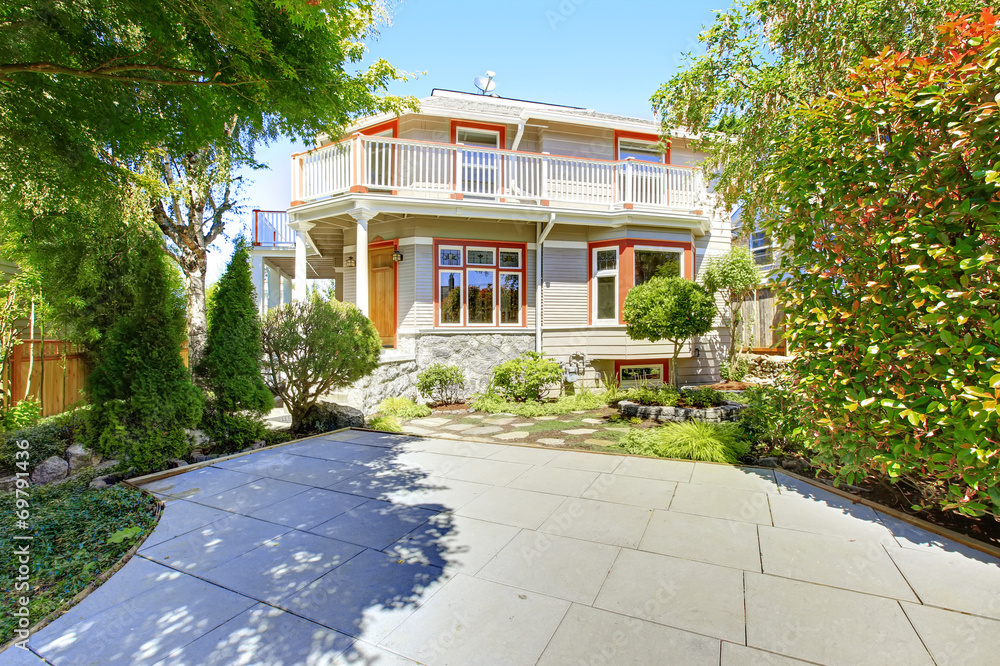 Fototapeta premium House with wrap-around walkout deck. Backyard view