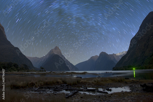 Milford sound at night with startrail, New Sealand