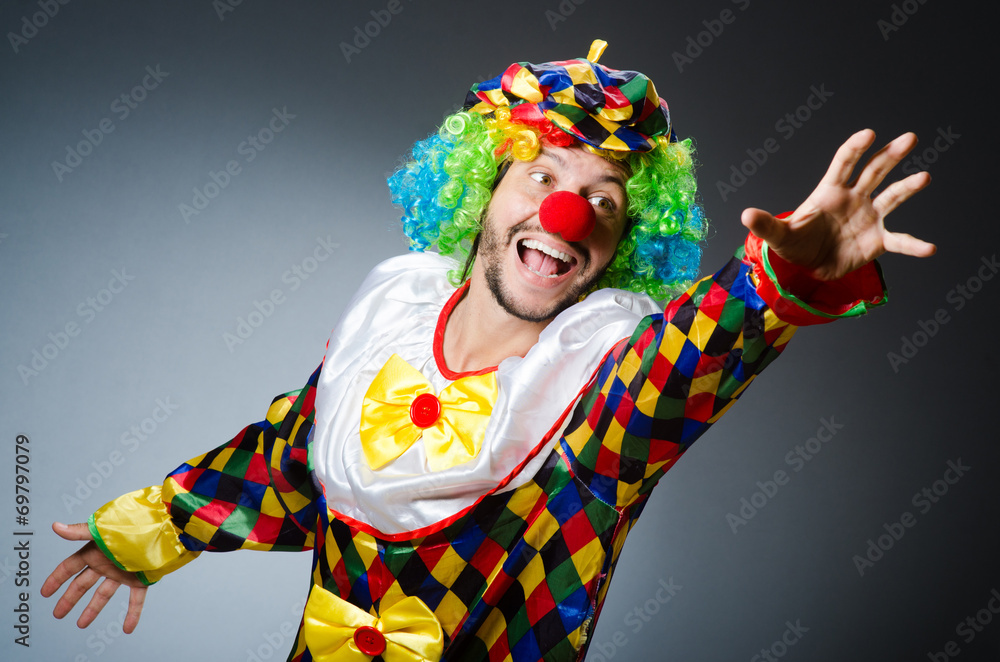 Funny clown in colourful costume