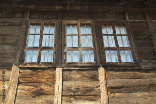 Stylish windows on wooden house