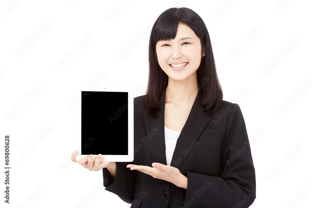 タブレットを持って案内するビジネスウーマン タブレットを持って案内するビジネスウーマン