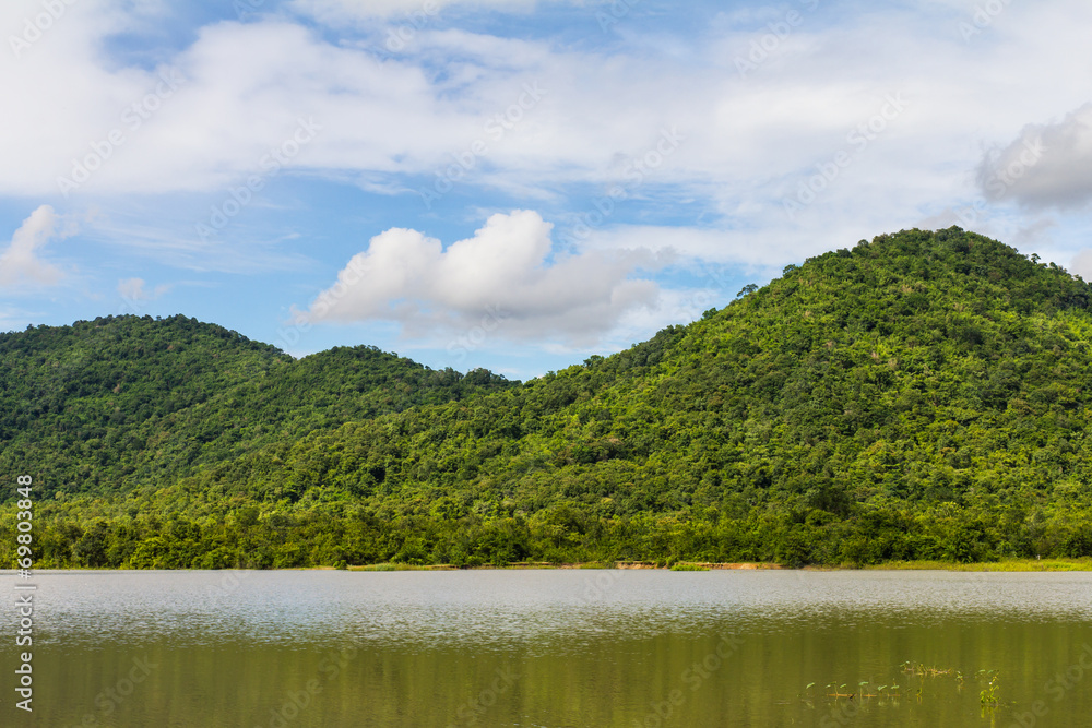 View of mountains in a lake of Thailand, which has a green tree. View of mountains in a lake of Thailand, which has a green tree.