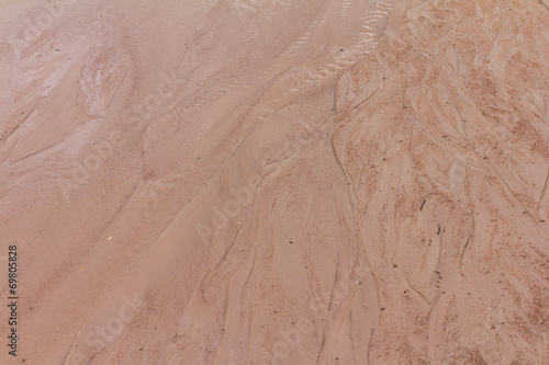Background surface sand with traces of water flowing