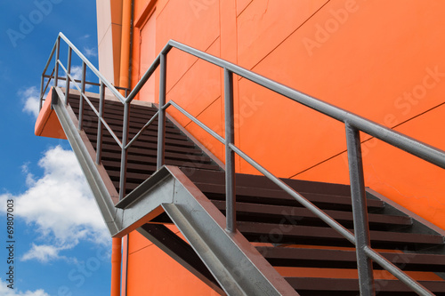 Metal fire escape or emergency exit on Orange Wall of Buliding W
