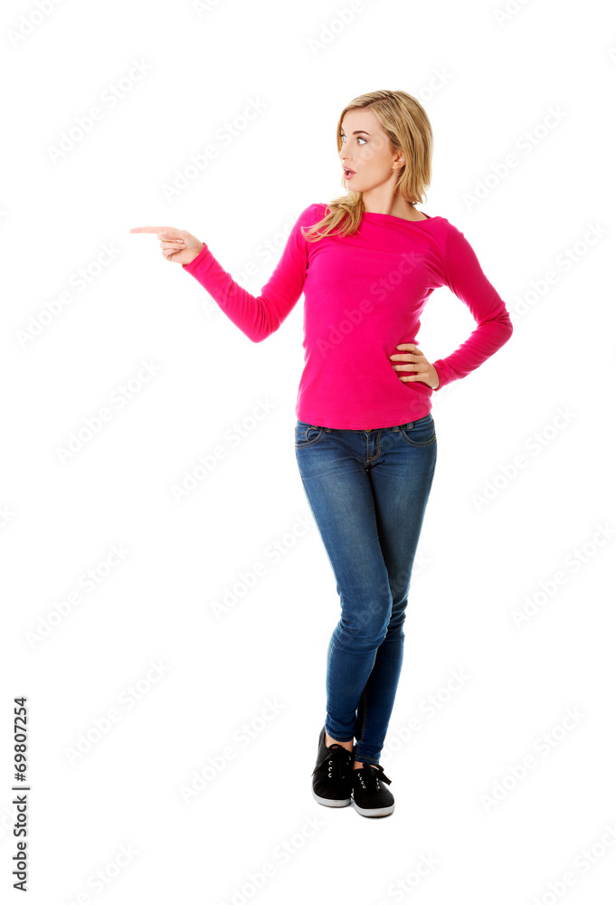 Casual woman presenting a copyspace. Casual woman presenting a copyspace.