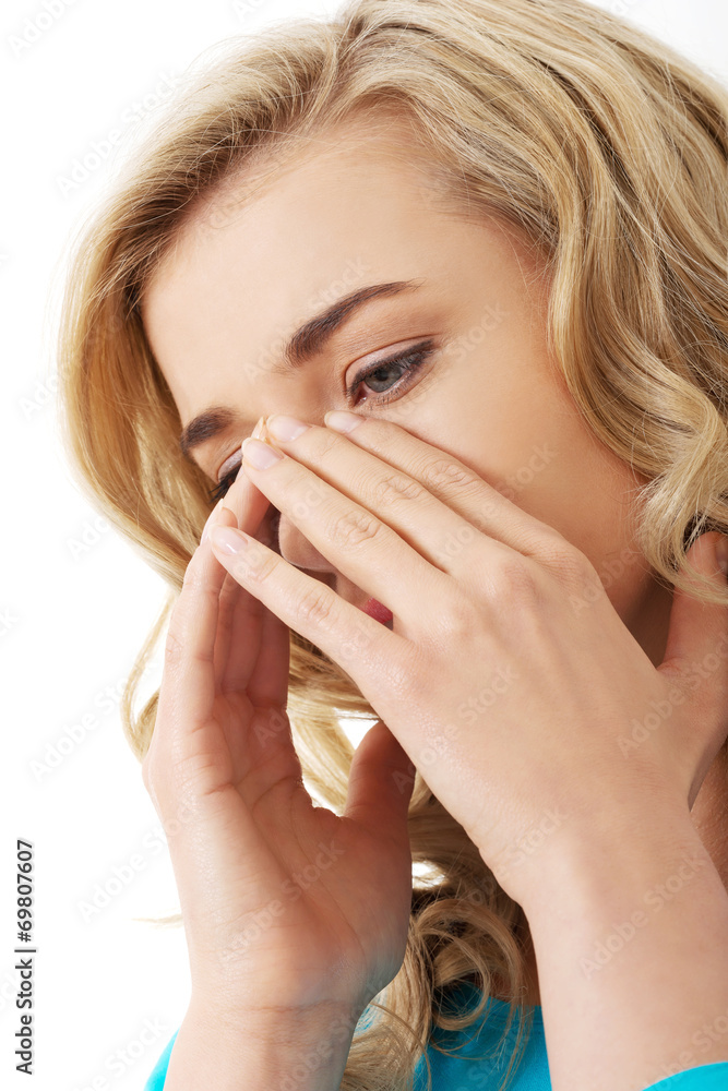 Woman with sinus pressure pain Woman with sinus pressure pain