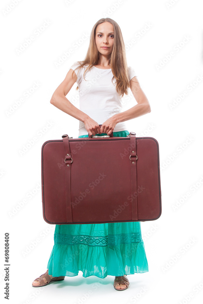 Girl standing with suitcase. Isolated on white Girl standing with suitcase. Isolated on white