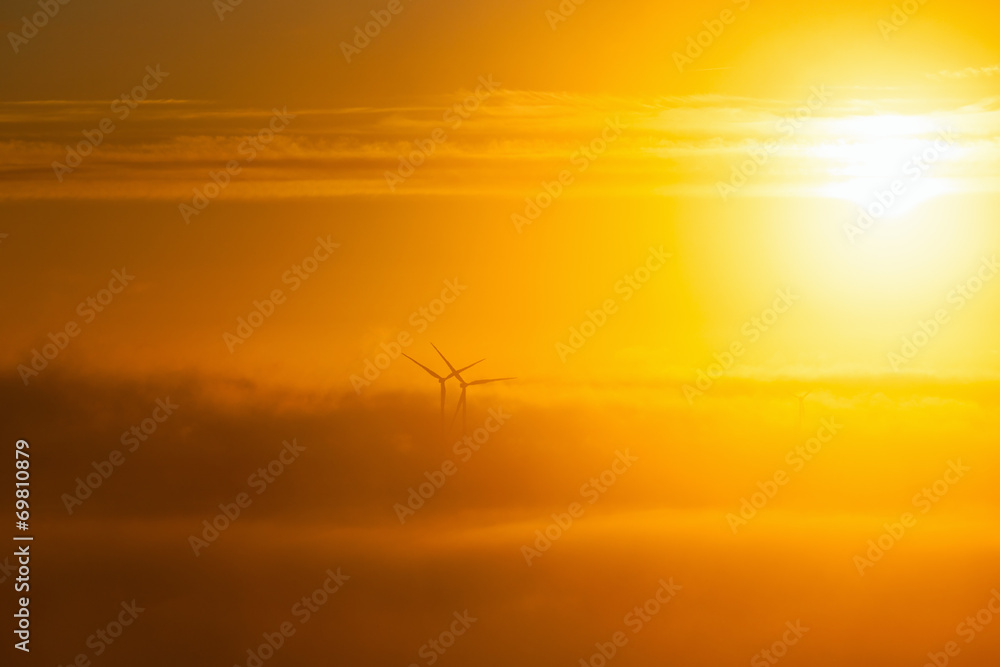 Wind turbines in misty morning Wind turbines in misty morning