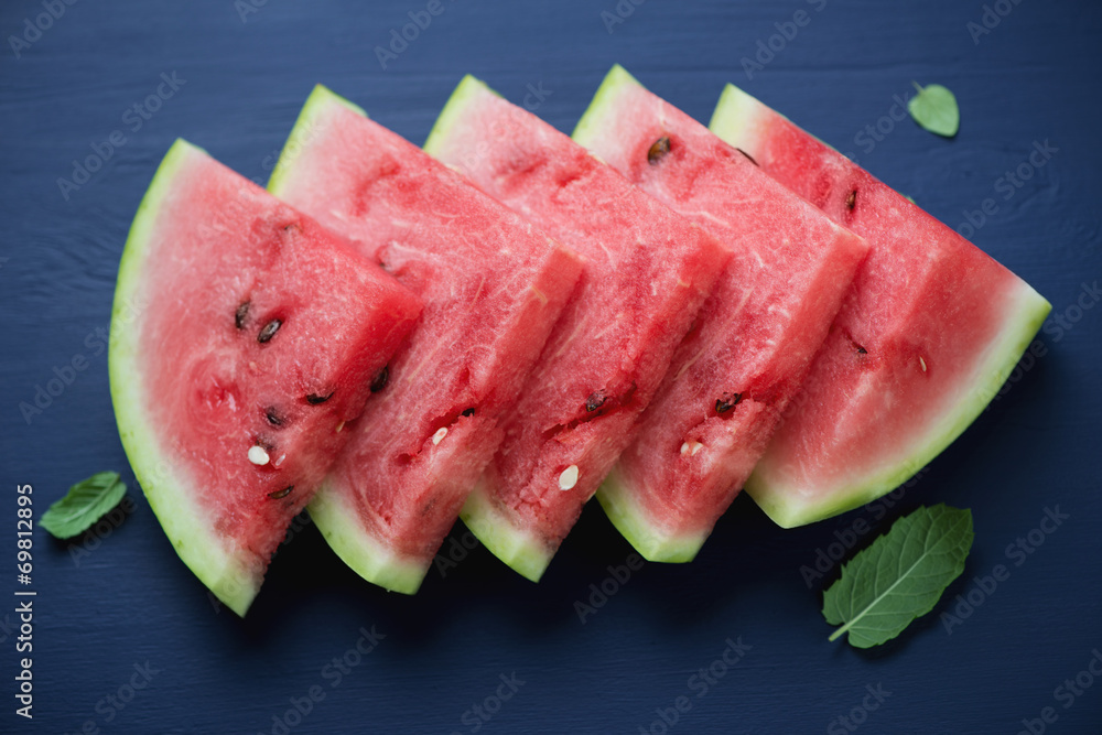 Sliced watermelon with fresh mint, high angle view Sliced watermelon with fresh mint, high angle view