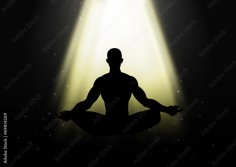 Silhouette of a man figure meditating under the light