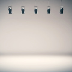 Bright photo studio background with spotlights