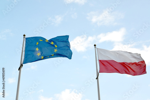 National flag of Poland and flag of the European Union flutter a