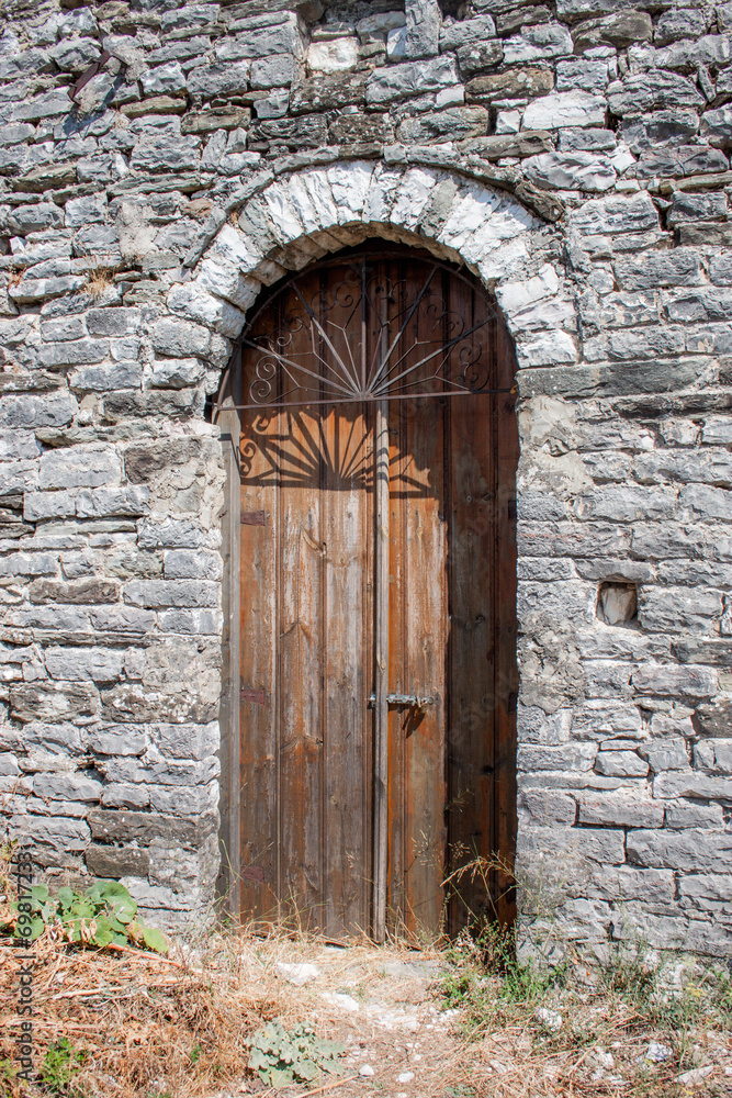 Ancient bown wood door in Gjirokaster