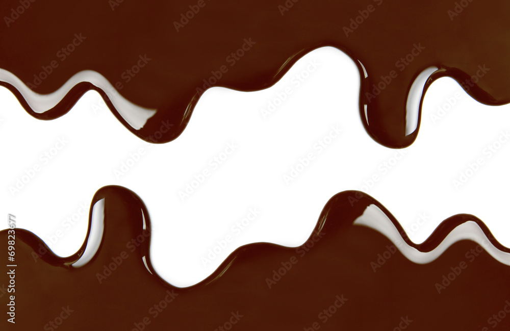 Melted chocolate dripping on white background Melted chocolate dripping on white background