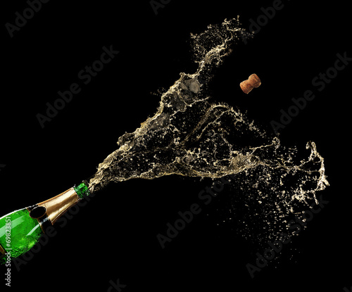 Champagne splashes on black background