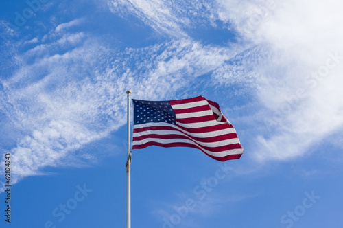 American flag waving on clods