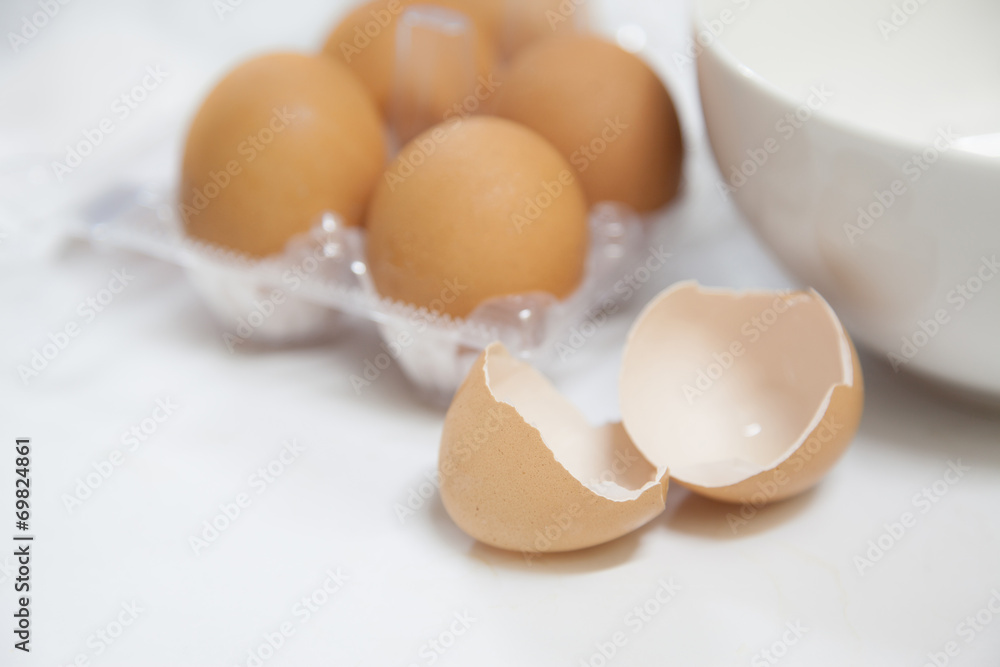 Egg shells with white bowl and carton Egg shells with white bowl and carton