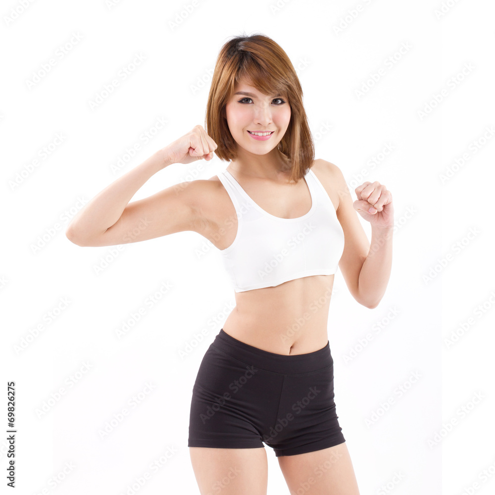 strong, fit, firm woman checking her arm muscle strength strong, fit, firm woman checking her arm muscle strength