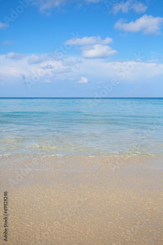 Natural background of sand beach and blue sky