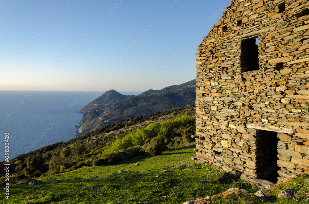 Ruins in a Corsican landscape (France) - evening light and sea Ruins in a Corsican landscape (France) - evening light and sea
