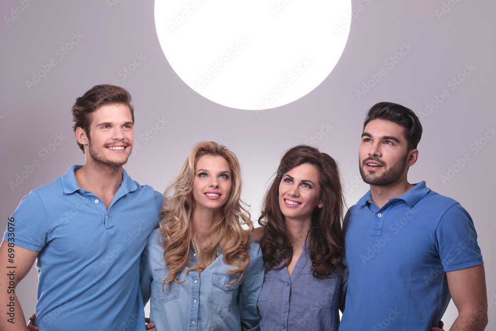 casual people looking up into a big ball of light casual people looking up into a big ball of light