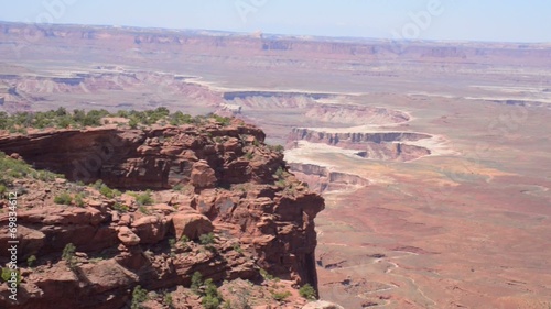Attractive women sitting on the edge of the canyon rim