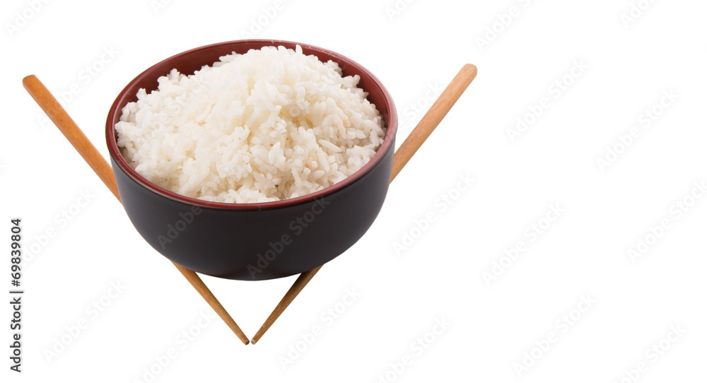 A bowl of rice and a pair of chopstick over white background A bowl of rice and a pair of chopstick over white background
