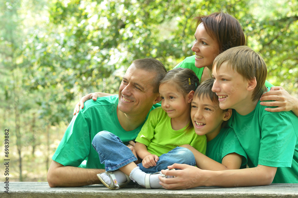 Family in green jersey resting