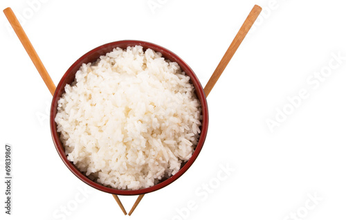 A bowl of rice and a pair of chopstick over white background