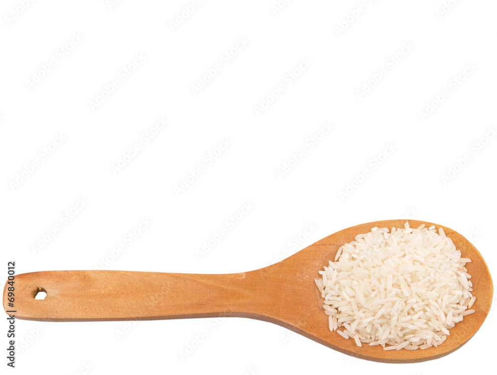 Raw and uncooked rice in wooden spoon over white background Raw and uncooked rice in wooden spoon over white background