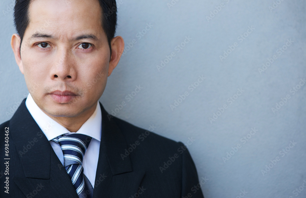 Smart businessman on gray background Smart businessman on gray background