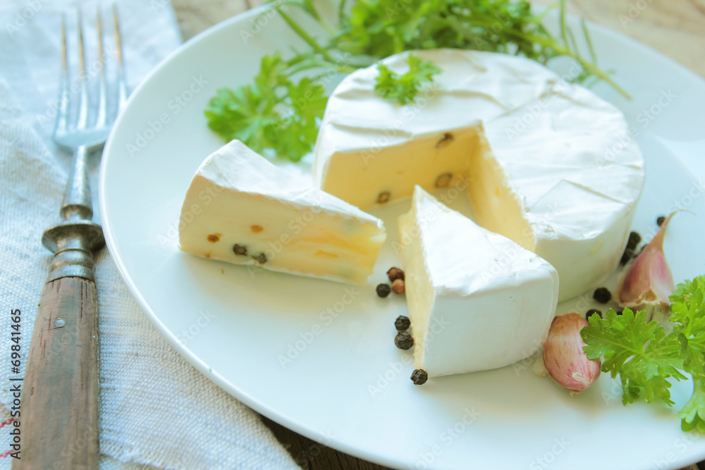 Camembert cheese with fresh herbs for appetizer