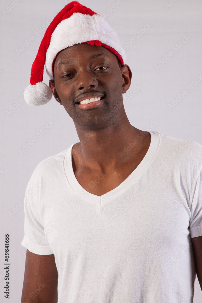 Black man smiling in Santa Hat Black man smiling in Santa Hat